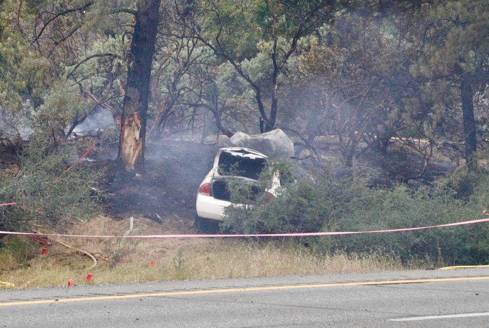 A car crashed along northbound Interstate 5 on Thursday afternoon, May 26, 2022, where there was an officer-involved shooting. The shooting took place near the O'Brien rest area and shut down northbound I-5 for hours.