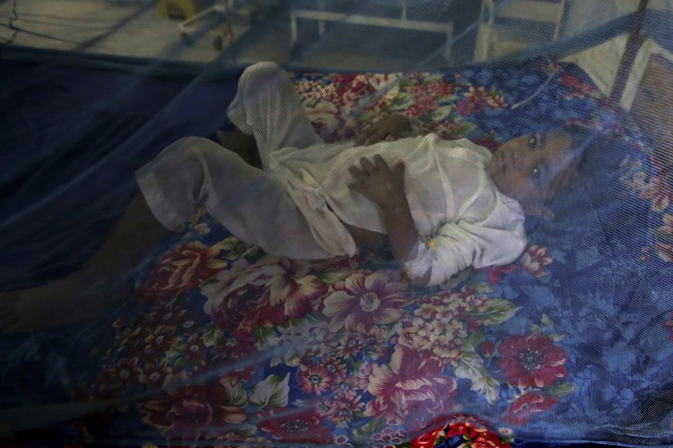 FILE - A child suffering from dengue fever, a mosquito-borne disease, is treated at a hospital, in Peshawar, Pakistan, Sept. 16, 2022. The flooding in Pakistan killed at least 1,700 people, destroyed millions of homes, wiped out swathes of farmland, and caused billions of dollars in economic losses. In Khyber Pakhtunkhwa, residents had to rely on contaminated water, so now authorities are taking steps to prepare for the next disaster. (AP Photo/Muhammad Sajjad, File)