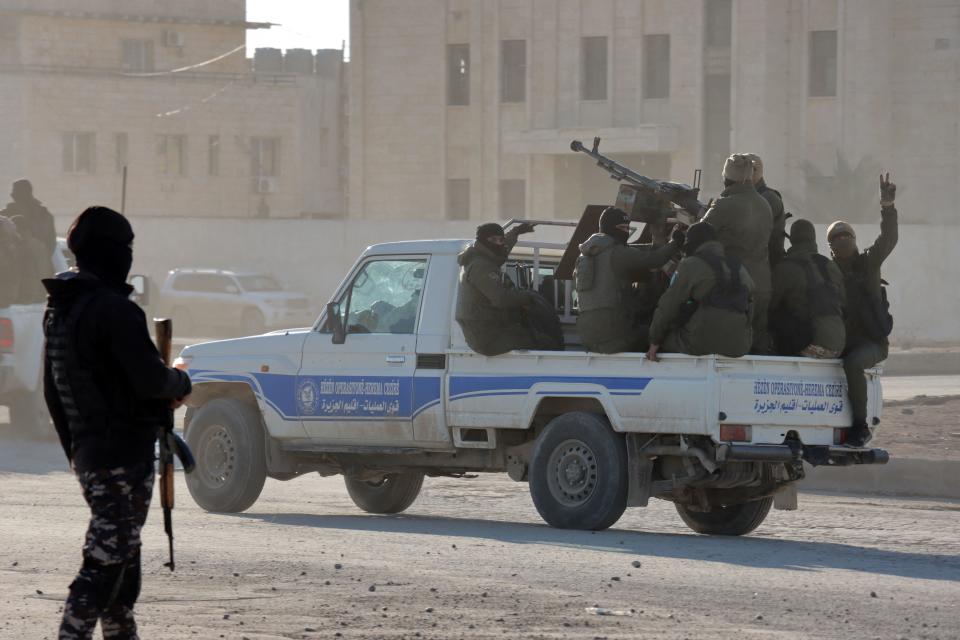 Members of the Syrian Democratic Forces (SDF) deploy around a prison in Syria's northeast city of Hasakah, January 25, 2022. / Credit: AFP/Getty