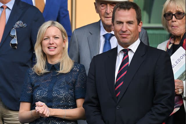 <p>Karwai Tang/WireImage</p> Lindsay Wallace and Peter Phillips at Wimbledon in July 2022