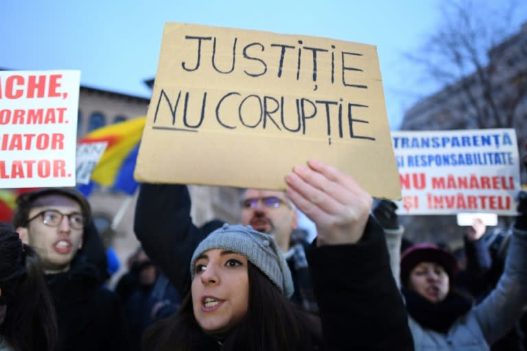 A woman holds a placard reading "Justice not Corruption" during a protest against government corruption in Bucharest January 22, 2017