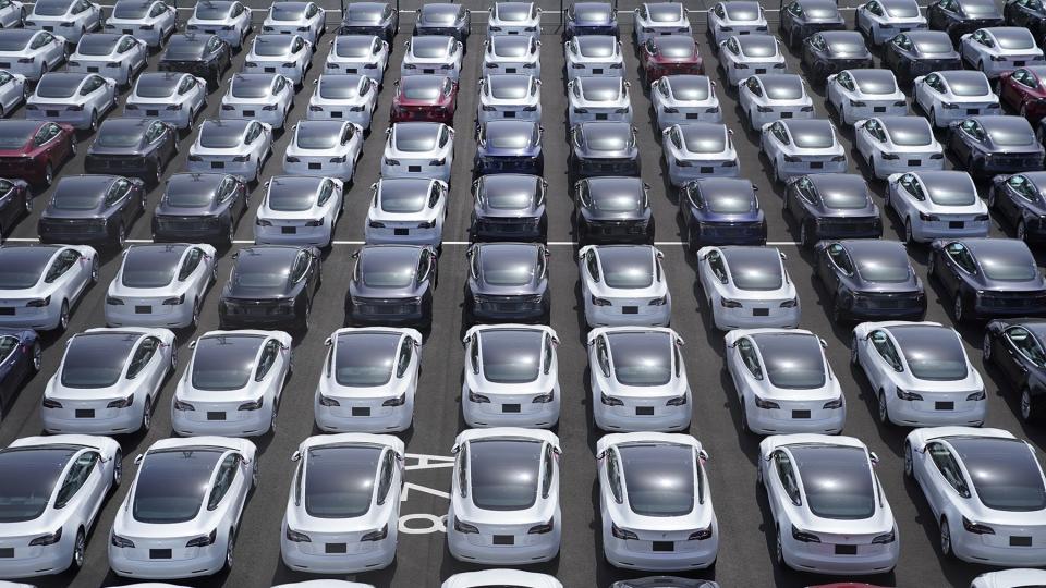 Tesla Inc. vehicles in a parking lot after arriving at a port in Yokohama, Japan