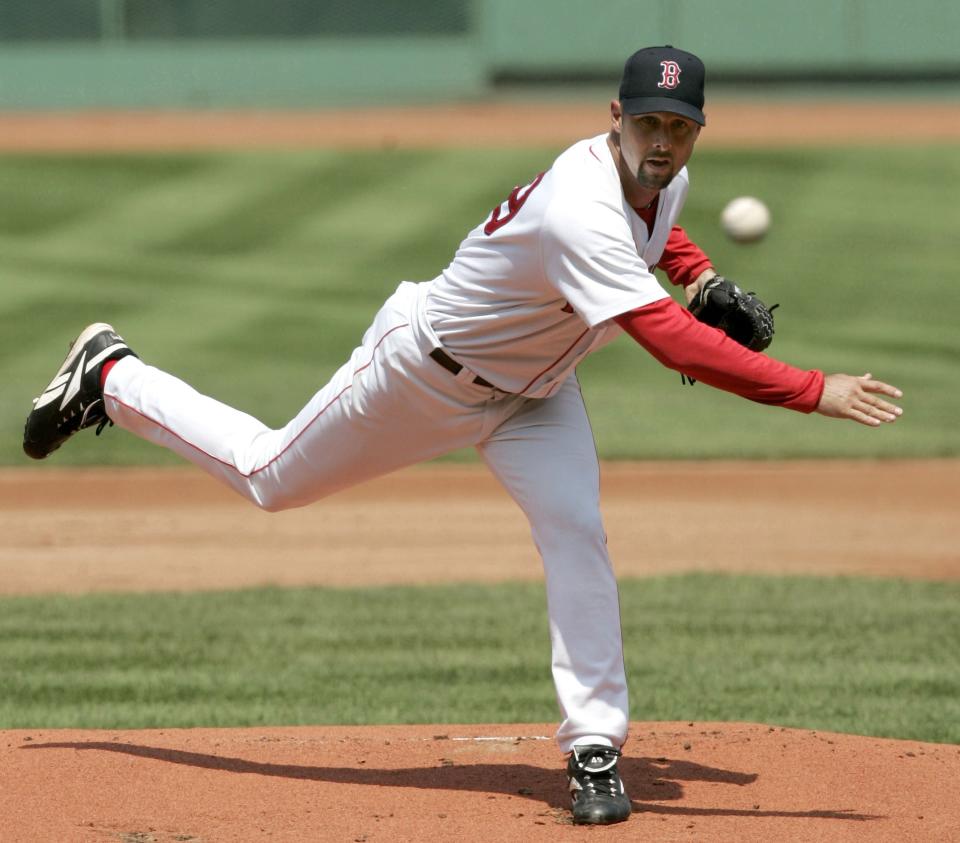 Boston Red Sox pitcher Tim Wakefield throws a knuckle ball against the Texas Rangers Sunday, July 11, 2004. The Rangers beat the Red Sox 6-5 at Fenway Park in Boston Massachusetts on July 11, 2004. (Photo by J Rogash/Getty Images)