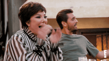 Kris Jenner and Scott Disick from "Keeping Up With The Kardashians" cheer.