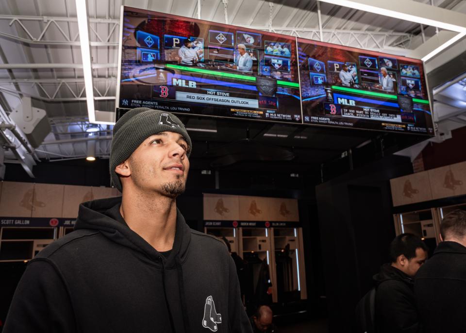 Red Sox second baseman Vaughn Grissom eyes an MLB Network report on TV during the Red Sox Rookie Development Program at Fenway Park in January.