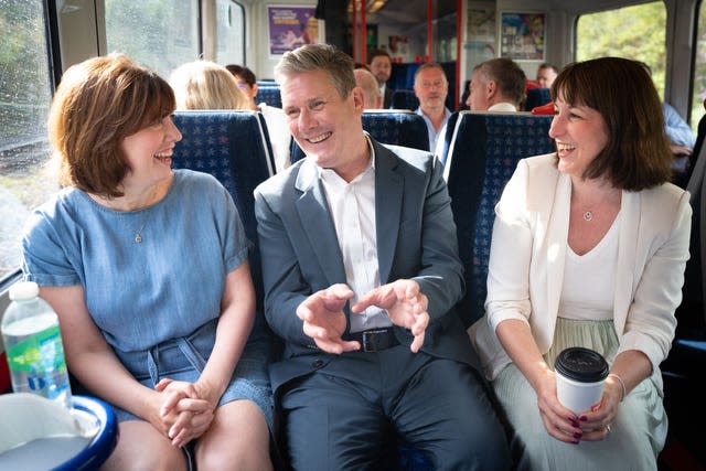 Labour leader Sir Keir Starmer with shadow culture secretary, Lucy Powell (left) and shadow chancellor, Rachel Reeves as they travel by train with other members of his shadow cabinet to High Wycombe 