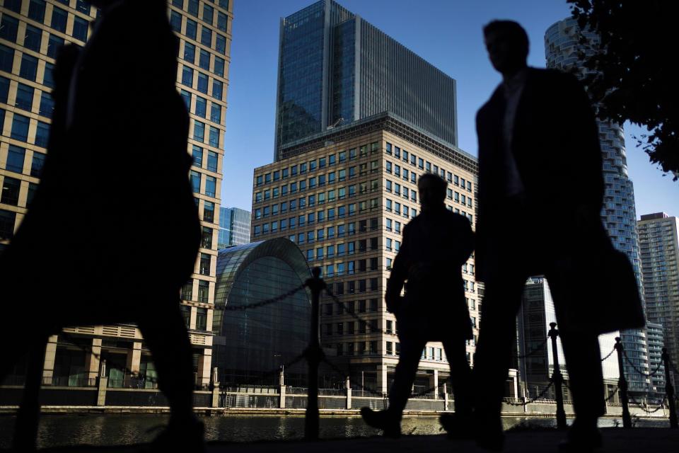 GDP File photo dated 06/10/2021 of office workers and commuters walking through Canary Wharf in London during the morning rush hour. The UK economy will witness 