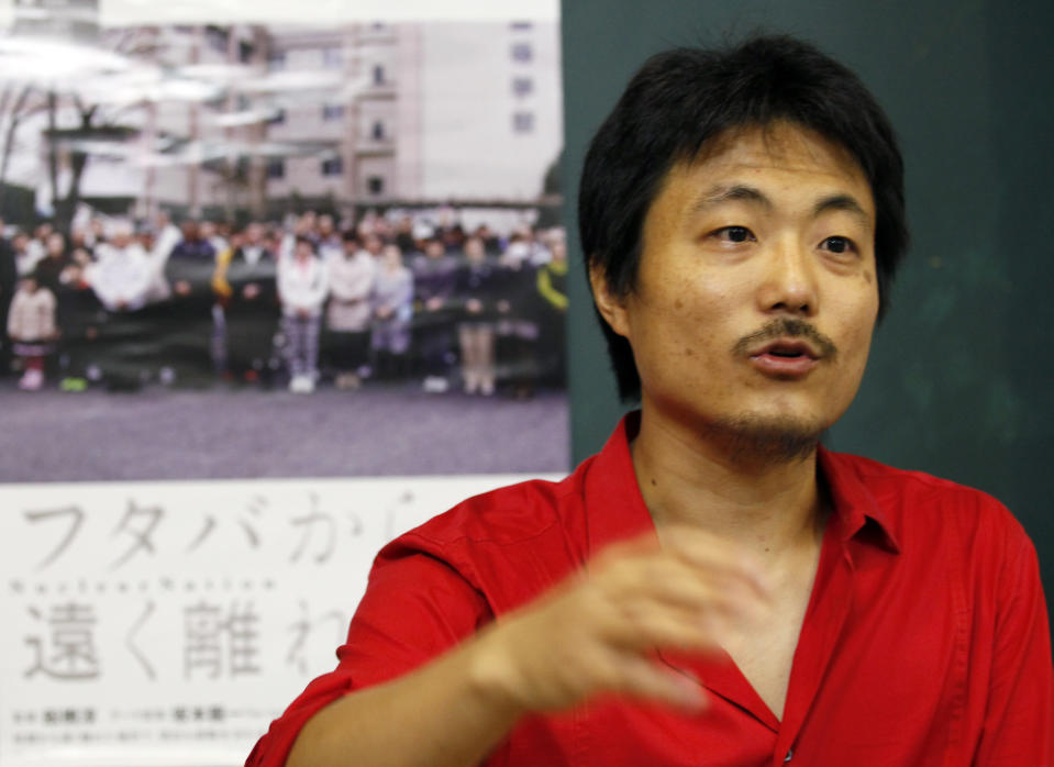 In this photo taken Sept. 11, 2012, Atsushi Funahashi, director of the film "Nuclear Nation," speaks during an interview in Tokyo Tuesday, Sept. 11, 2012. His film documented a story of the residents of Futaba, Fukushima prefecture, the town where the tsunami crippled Fukushima Dai-ichi nuclear power plant is located. The March 2011 catastrophe in Japan has set off a flurry of independent films telling the stories of regular people who became overnight victims, stories the creators feel are being ignored by mainstream media and often silenced by the authorities. Nearly two years after the quake and tsunami disaster, the films are an attempt by the creative minds of Japan’s movie industry not only to confront the horrors of the worst nuclear disaster since Chernobyl, but also as a legacy and to empower the victims by telling their story for international audiences. (AP Photo/Koji Sasahara)