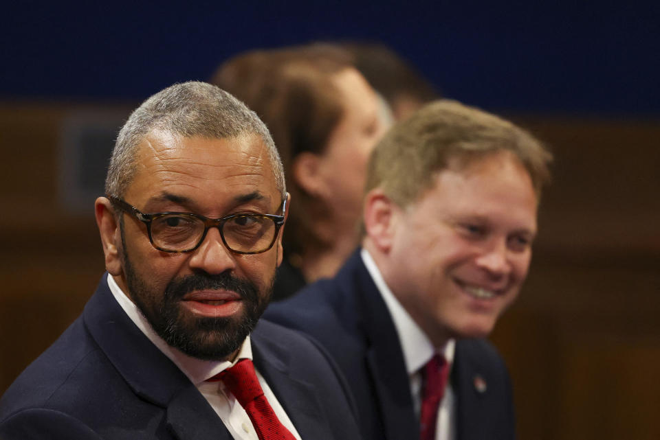 British Home Secretary James Cleverly, left, and Defence Secretary Grant Shapps attend a press conference by British Prime Minister Rishi Sunak at Downing Street, in London, Monday, April 22, 2024. Sunak pledged Monday that the country’s first deportation flights to Rwanda could leave in 10-12 weeks as he promised to end the Parliamentary deadlock over a key policy promise before an election expected later this year. (Toby Melville/Pool Photo via AP)