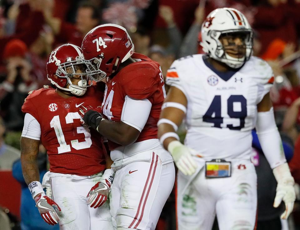 Alabama WR ArDarius Stewart (13) and OT Cam Robinson (74) are heading to the NFL. (Getty)