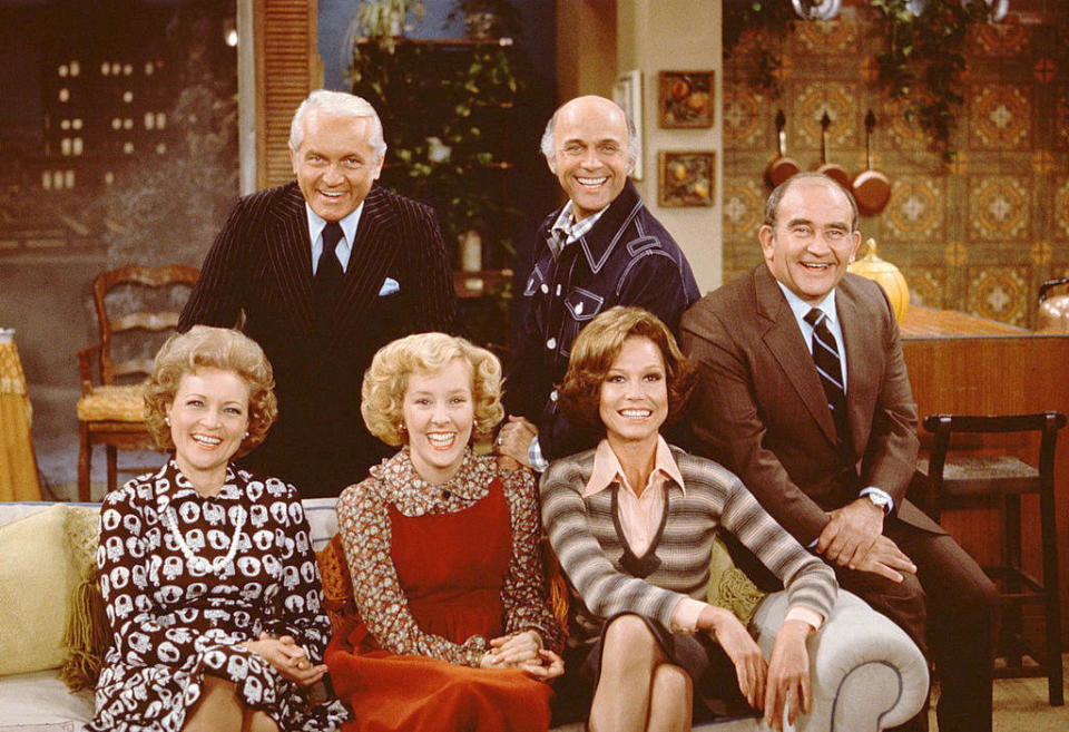 Betty White and Georgia Engel pose with the cast of "The Mary Tyler Moore Show," including Mary Tyler Moore and, back row from left, Ted Knight, Gavin MacLeod and Ed Asner, on Nov. 21, 1975. (Photo: CBS Photo Archive/Getty Images) 