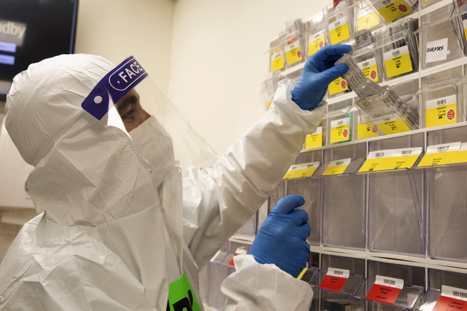 A medical professional pulls patient medication in the coronavirus ward at the Shaare Zedek Medical Center in Jerusalem, Tuesday, Aug. 31, 2021. (AP Photo/Maya Alleruzzo)