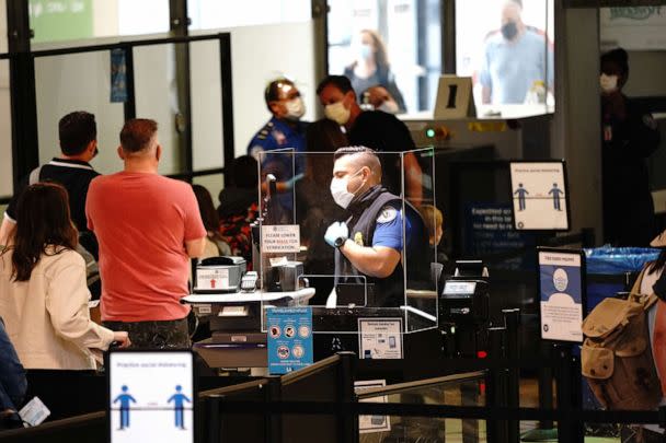 PHOTO: In this May 28, 2021, file photo, travelers go through a Transportation Security Administration (TSA) checkpoint at Los Angeles International Airport (LAX) in Los Angeles. (Bloomberg via Getty Images, FILE)