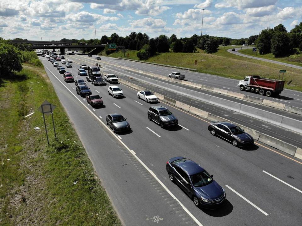 Drivers crawl along I-485 near the Johnston Road interchange on Thursday, May 6, 2021. Expect more closures and detours at the exit as crews continue bridge work for the I-485 express lanes project.