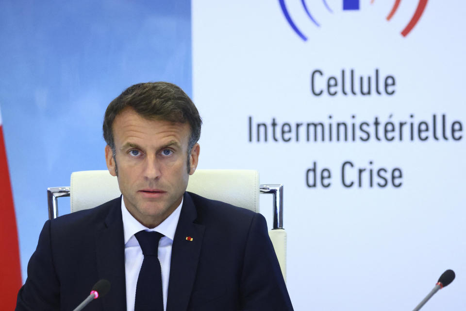 French President Emmanuel Macron speaks following a government emergency meeting after riots erupted for the third night in a row across the country, at the Interior Ministry in Paris, Friday, June 30, 2023. Emmanuel Macron is urging parents to keep teenagers at home to quell rioting spreading across France and says social media are fueling copycat violence. After a second crisis meeting with senior ministers, Macron said that social media are playing a "considerable role" in the spreading unrest triggered by the deadly police shooting of a 17 year old. (Yves Herman/Pool via AP)