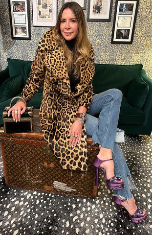 <p>Dianne Vavra</p> Dianne Vavra poses on a vintage Louis Vuitton trunk at Vavra New York. CREDIT: JOHN D'ANGELO