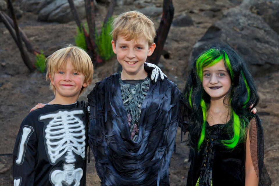 Portrait of three friends in Halloween costume