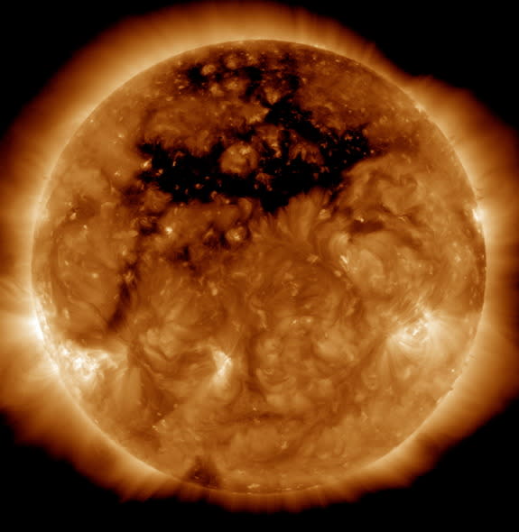 A photo of the sun from NASA's orbiting Solar Dynamics Observatory reveals an enormous coronal hole — a gap in the sun's outer layer and magnetic field the size of 50 Earths. The image was captured Oct