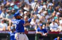 Kansas City Royals' Nelson Velazquez follows through on a two-run home run to score Michael Massey against the Seattle Mariners during the eighth inning of a baseball game, Sunday, Aug. 27, 2023, in Seattle. (AP Photo/Lindsey Wasson)