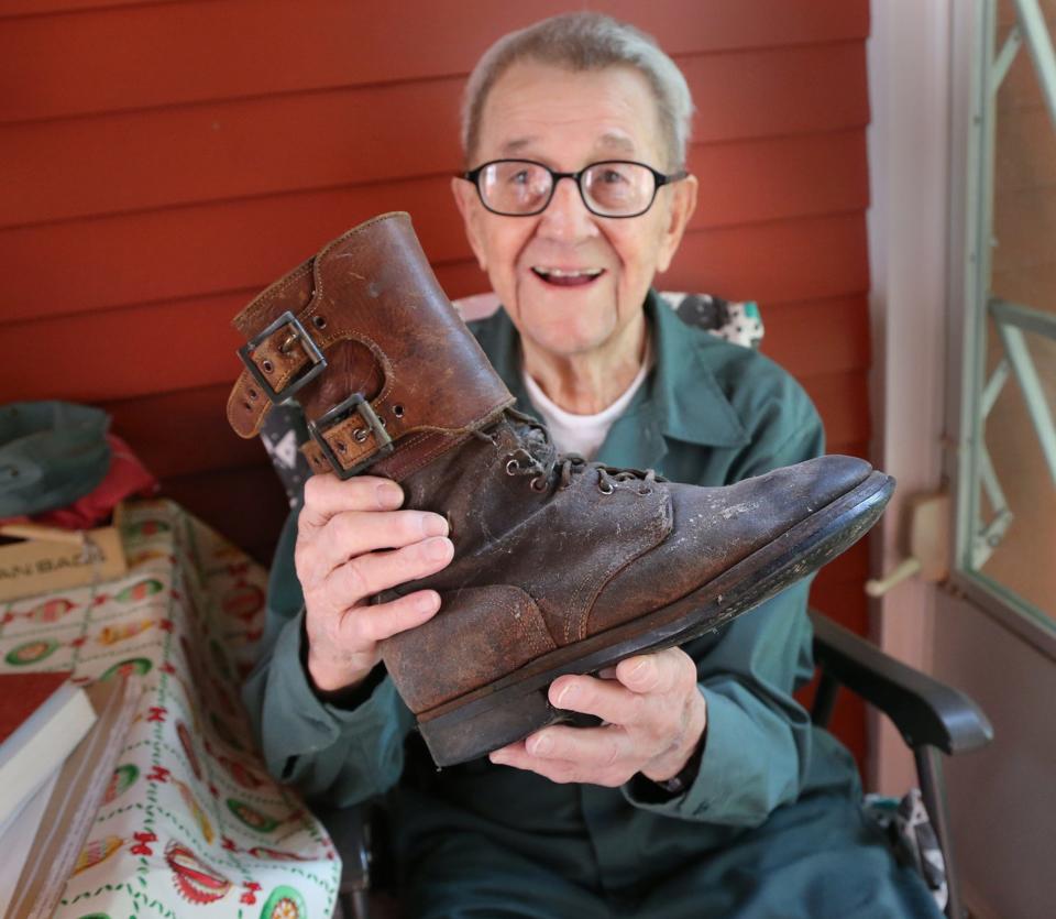 Among memorabilia Tonie Darvid brought back from World War II are the boots he wore. He recounts how he and his fellow soldiers coated their boots with asbestos and wax to protect their feet in the event the Germans were to use gas on the American soldiers.