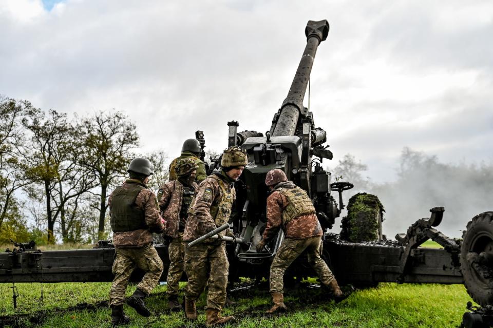 Ukrainian troops fire a 155 mm FH70 howitzer