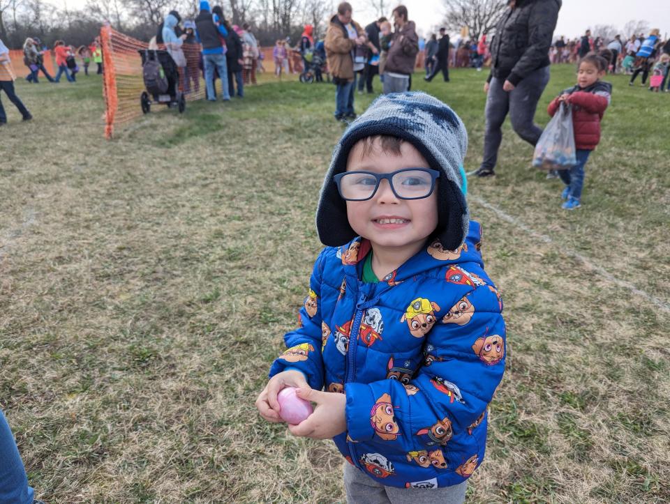 Niko Anguiano, 3, holds his prize Easter egg. The Church of 53 in Fremont hosted a helicopter Easter egg drop Saturday for more than 1,000 children, giving kids more than 20,000 Easter eggs full of candy.