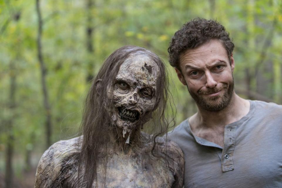 Ross Marquand, seen here portraying Aaron on “The Walking Dead” with an uncredited zombie extra, is one of the guests at Des Moines Con this weekend at the Iowa Events Center.