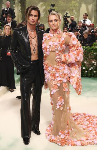 <p>John Shearer/WireImage</p> Chase Stokes in Michael Kors Collection and Kelsea Ballerini in couture Michael Kors Collection on the 2024 Met Gala red carpet on May 6