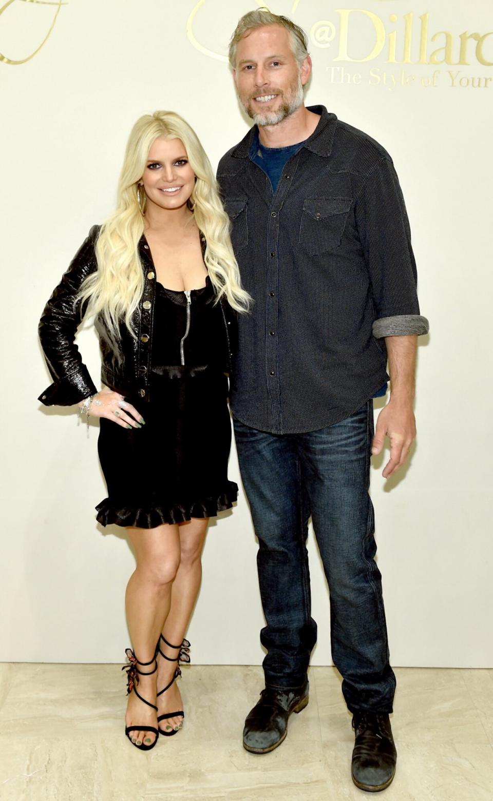 Jessica Simpson and Eric Johnson take photos during a spring style event in Dillards at The Mall at Green Hills hosted by Jessica Simpson on April 7, 2018 in Nashville, Tennesse