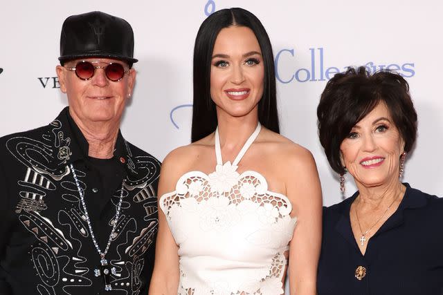 <p>Monica Schipper/Getty</p> Katy Perry and her parents, dad Keith Hudson (left) and mom Mary Hudson (right) at the 35th Annual Colleagues Spring Luncheon & Oscar de la Renta Fashion Show on April 25