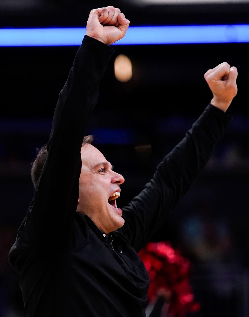 NorthWood Panthers head coach Aaron Wolfe yells in excitement Saturday, March 25, 2023 at Gainbridge Fieldhouse in Indianapolis. The NorthWood Panthers lead at the half against the Guerin Catholic Golden Eagles, 66-63, in the IHSAA Class 3A state finals championship. 