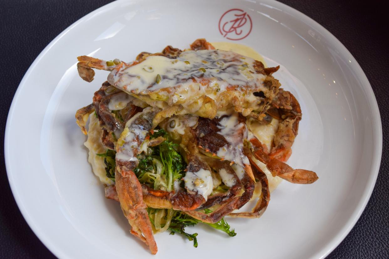 Jettie Rae's Oyster House's soft-shell crab dish is served with long-cooked grits, charred frisée and a lemon caper beurre blanc.