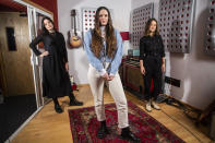 Members of the folk group The Staves, sisters, from left, Jessica, Camilla and Emily Staveley-Taylor pose in a north London recording studio to promote their album "Good Woman", on Monday, Feb. 15, 2021. (Photo by Joel C Ryan/Invision/AP)
