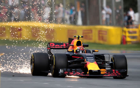 Formula One - F1 - Australian Grand Prix - Melbourne, Australia - 24/03/2017 Red Bull Racing driver Max Verstappen of the Netherlands showers sparks on the track during the first practice session. REUTERS/Jason Reed