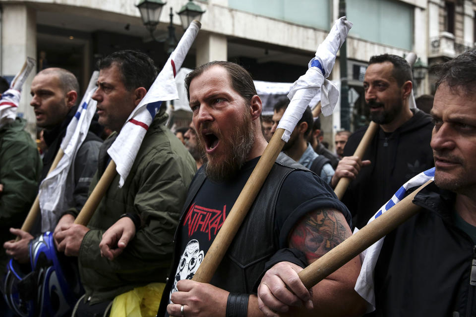 <p>Protesters chant slogans as they take part in an anti-government rally during a 24-hour labour strike in Athens, Greece, on Wednesday, May 17, 2017. Greeces economy returned to recession in the first quarter as delays in concluding talks between the government and its creditors raised the specter of another debt drama. (Yorgos Karahalis/Bloomberg via Getty Images) </p>