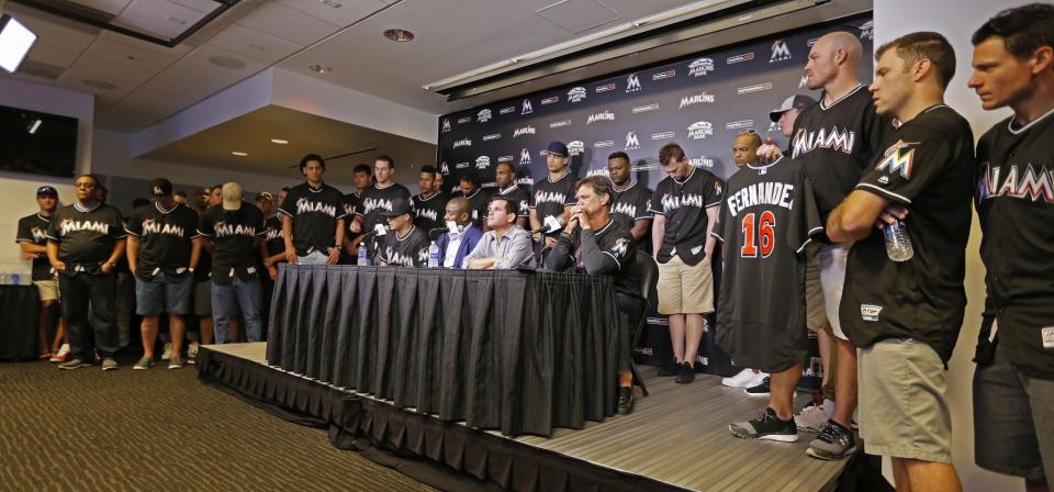 <p>Team executives, surrounded by the Miami Marlins, take part in a press conference following the death of pitcher Jose Fernandez in a boating accident, at Marlins Park on September 25, 2016 in Miami, Florida. (Photo by Joe Skipper/Getty Images) </p>