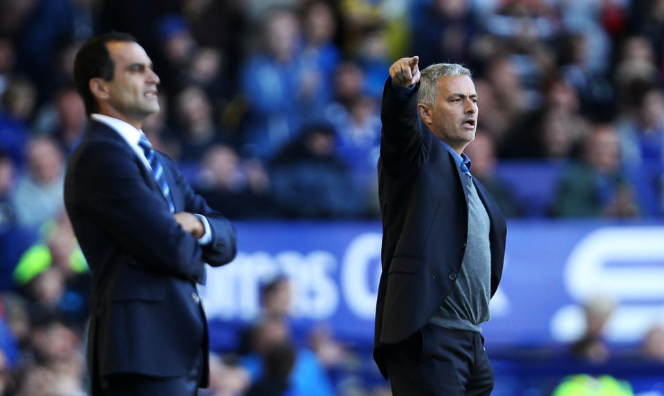 Everton's manager Roberto Martinez and Chelsea's manager Jose Mourinho (right) during the Barclays Premier League match at Goodison Park, Liverpool.