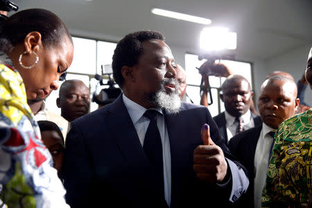 FILE PHOTO: Democratic Republic of Congo President Joseph Kabila displays ink on his hand after casting his vote at a polling station in Kinshasa, Democratic Republic of Congo, December 30, 2018. REUTERS/Baz Ratner/File Photo