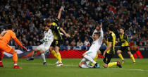 Soccer Football - Champions League - Real Madrid vs Borussia Dortmund - Santiago Bernabeu, Madrid, Spain - December 6, 2017 Real Madrid’s Cristiano Ronaldo in action with Borussia Dortmund’s Neven Subotic REUTERS/Juan Medina