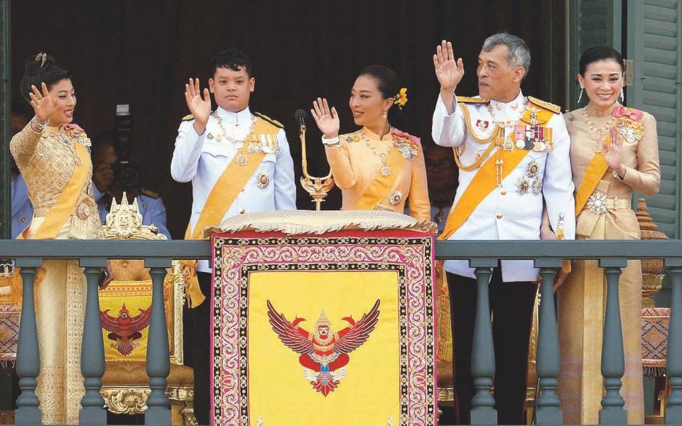 Newly crowned K.M.V, Queen Suthida and Prince and Princesses are seen at the balcony of Suddhaisavarya Prasad Hall at the Grand Palace where the King grants a public audience to receive the good wishes of the people of Bangkok, 2019 - Reuters