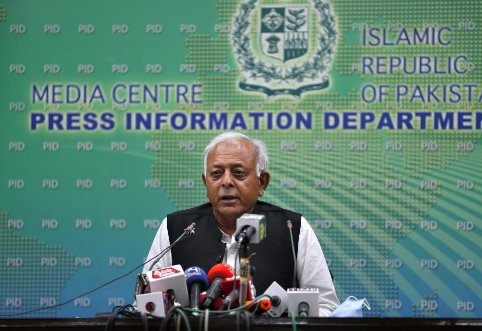 Pakistan's aviation minister Ghulam Sarwar Khan speaks during a press conference in Islamabad, Pakistan, Wednesday, June 24, 2020. Khan said that “human error" on the part of the pilot, the co-pilot and air traffic control caused last month's plane crash in the port city of Karachi that killed all 97 people on board. (AP Photo/Anjum Naveed)