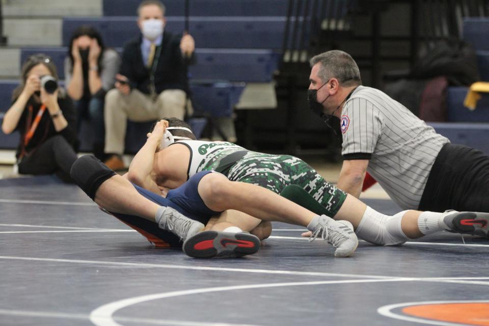 Pleasantville's Nick Paternostro (top) on his way to pinning Horace Greeley's Jon Kang (bottom) during the 145-pound match during a meet on Jan. 18, 2022.