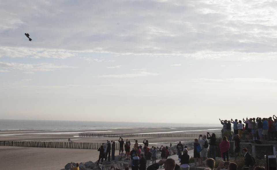 Franky Zapata, a 40-year-old inventor, takes to the air in Sangatte, Northern France, at the start of his attempt to cross the channel from France to England, aboard his flyboard, Sunday Aug. 4, 2019. Zapata will try again Sunday, to traverse the English Channel on a flying board after his first attempt failed when he crashed into a refueling boat 20 kilometers (12 miles) into the trip. (AP Photo/Michel Spingler)