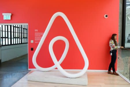 FILE PHOTO: A woman talks on the phone at the Airbnb office headquarters in the SOMA district of San Francisco, California, U.S., August 2, 2016.  REUTERS/Gabrielle Lurie