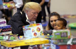 Donald Trump chats with a young victim of Hurricane Harvey