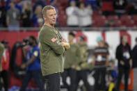 New York Giants offensive coordinator Jason Garrett watches players warm up before an NFL football game against the Tampa Bay Buccaneers, Monday, Nov. 22, 2021, in Tampa, Fla. The New York Giants have fired offensive coordinator Jason Garrett after a dreadful performance in a nationally televised game against the Tampa Bay Buccaneers. The Giants (3-7) tweeted the decision Tuesday afternoon, saying the former Dallas Cowboys head coach had been relieved of his duties. (AP Photo/Phelan M. Ebenhack)