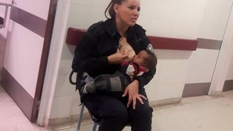 Photo of police officer breastfeeding underfed baby goes viral. (Photo: Marcos Heredia via Facebook)