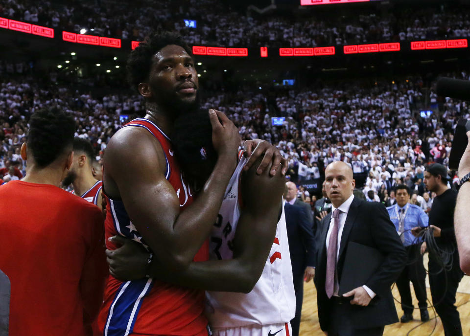 TORONTO, ON- MAY 12 - Toronto Raptors forward Pascal Siakam (43) is congratulated by his fellow countryman Philadelphia 76ers center Joel Embiid (21) as the Toronto Raptors beat the Philadelphia 76ers 92-90 in game seven of their second round series in the NBA play-offs at Scotiabank Arena in Toronto. May 12, 2019. (Steve Russell/Toronto Star via Getty Images)