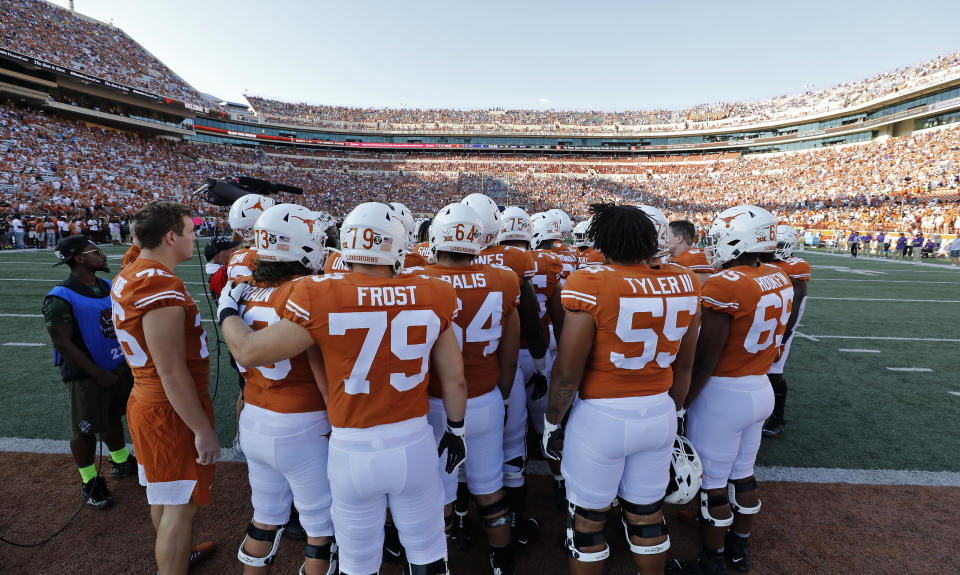 Members of the Texas Longhorns football team huddle before the game against the LSU Tigers, Saturday Sept. 7, 2019 at Darrell K Royal-Texas Memorial Stadium in Austin, Tx. ( Photo by Edward A. Ornelas )