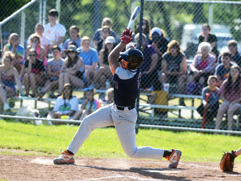 Wade Pauley takes a swing for Morgan during a Division II sectional final against visiting John Glenn last season. Pauley, the MVL Small School Division Player of the Year, highlights a strong returning core for the Raiders.